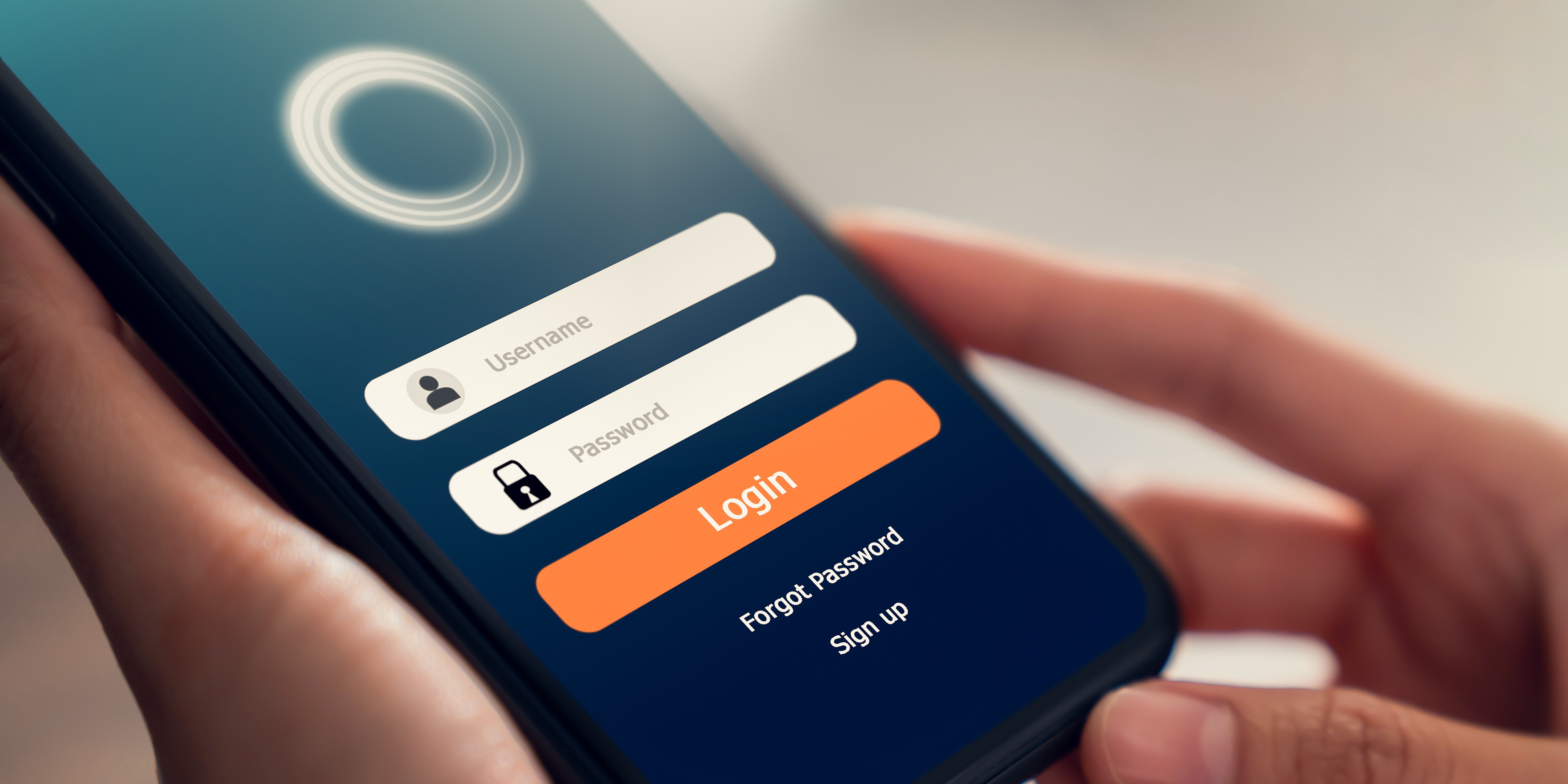 A person holds a smartphone displaying a login screen typical of enterprise mobile apps, with fields for username and password. The intuitive user experience includes a 